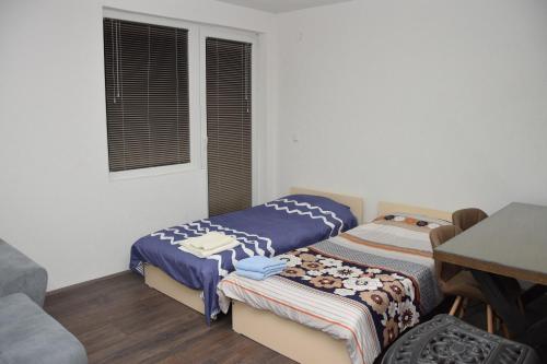 Postel nebo postele na pokoji v ubytování Markos Towers Apartments