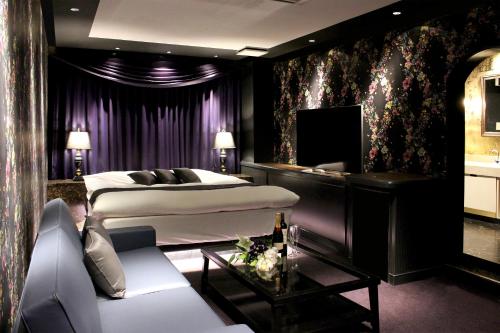 Katil atau katil-katil dalam bilik di Hotel LOVE MODERN