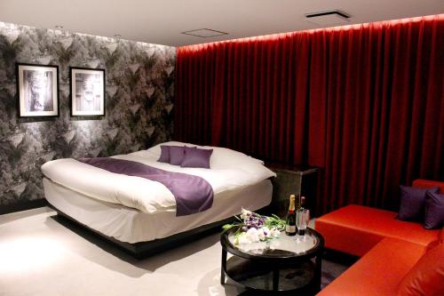 Katil atau katil-katil dalam bilik di Hotel LOVE MODERN