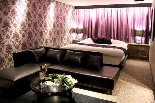 Katil atau katil-katil dalam bilik di Hotel LOVE MODERN