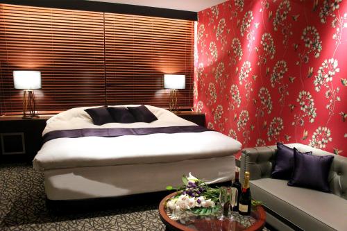 Katil atau katil-katil dalam bilik di Hotel LOVE MODERN