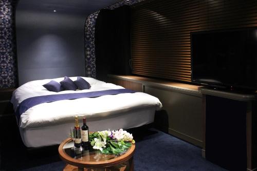 Katil atau katil-katil dalam bilik di Hotel LOVE MODERN