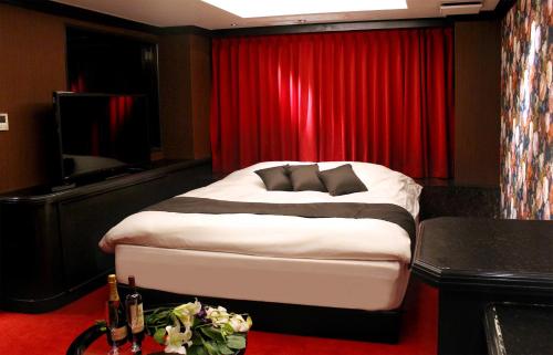 Katil atau katil-katil dalam bilik di Hotel LOVE MODERN