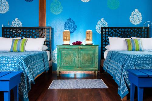 Postel nebo postele na pokoji v ubytování Blue Osa Beach Resort & Spa