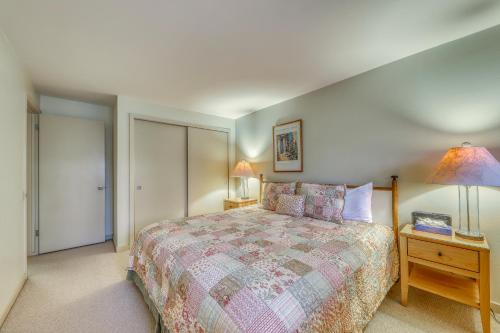 a bedroom with a bed and a table with a lamp at Dollar Meadows 1388 in Sun Valley