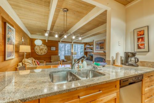 a kitchen with a sink and a living room at Dollar Meadows 1388 in Sun Valley