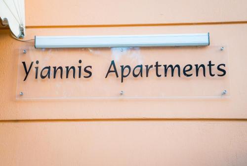 a sign on a door that reads vitamins apartments at Yiannis Apartments in Ioannina