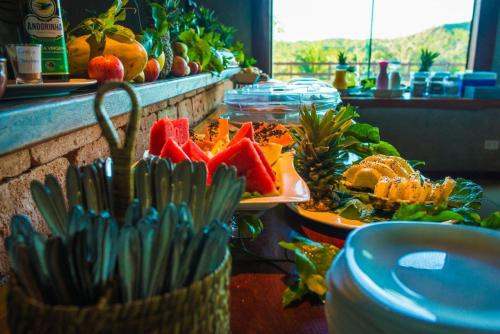 a buffet with a bunch of food on a table at Pousada Boyrá in Bonito