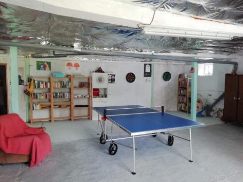 a room with a ping pong table in it at La Maison de Thelma in Bézues-Bajon