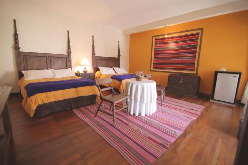 A bed or beds in a room at Mi Pueblo Samary Hotel Boutique