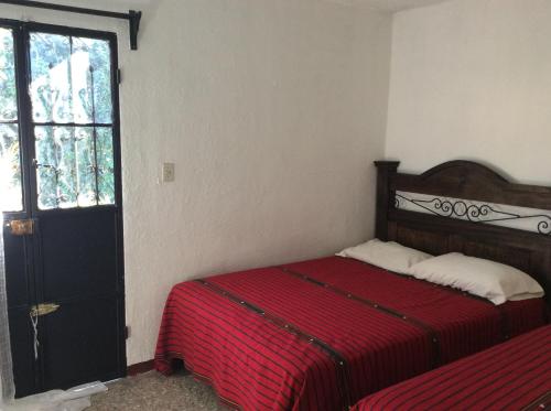 Postel nebo postele na pokoji v ubytování Casa Familiar