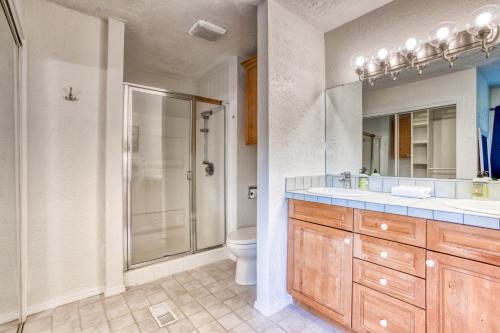 a bathroom with a shower and a sink and a toilet at Seabreeze Getaway in Warrenton