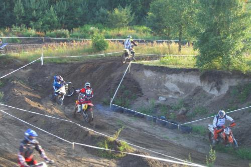 a group of people riding dirt bikes on a race track at Dom Wczasowy Pięciu Pomostów in Czaplinek