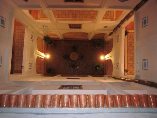 a large room with a large tub in a building at Hôtel Ras El Maa in Chefchaouene