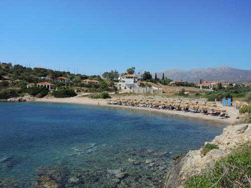 a view of a beach with chairs and the water at Elea Mare in Elia Laconias
