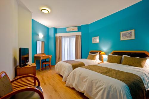 Ένα ή περισσότερα κρεβάτια σε δωμάτιο στο Hotel Αchillion Grevena