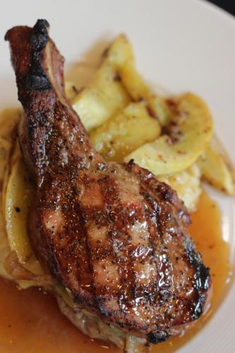 a piece of meat with potatoes and gravy on a plate at Majestic Inn and Spa in Anacortes