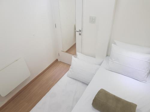 Ένα ή περισσότερα κρεβάτια σε δωμάτιο στο Quarto Privativo em Condominio