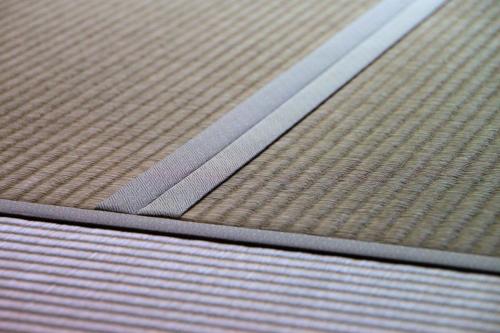 a close up of an empty metal mattress at Guest House Hitsujian in Kyoto