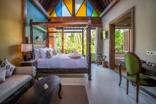Postel nebo postele na pokoji v ubytování Menzel Ubud