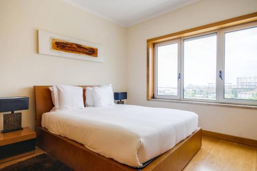 Ένα ή περισσότερα κρεβάτια σε δωμάτιο στο Cosy 2 bedroom apartment in Parque das Nações