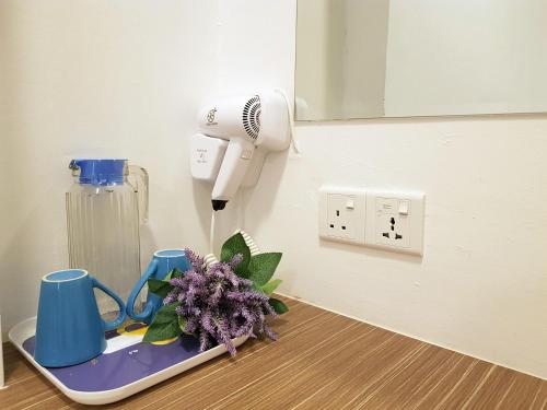 a room with a hair dryer on a table at casa 96 villa in Kuantan