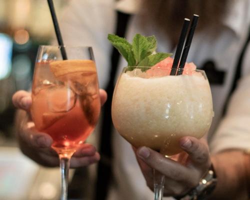 two people holding two drinks in their hands at Statt Hassleholm BW Signature Collection in Hässleholm
