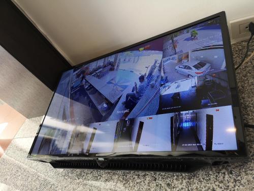 a large flat screen tv sitting on a floor at Betong Hello Hotel in Betong