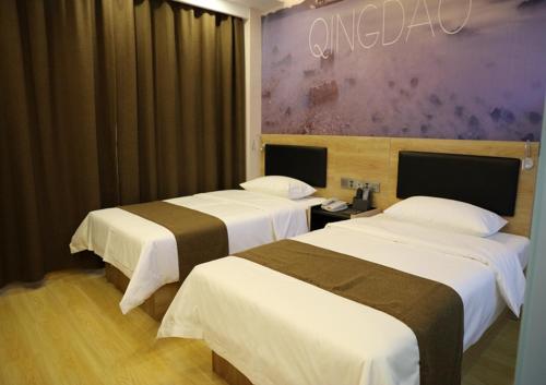 Postel nebo postele na pokoji v ubytování Thank Inn Plus Hotel Shandong Qingdao Jimo Development Zone New Government