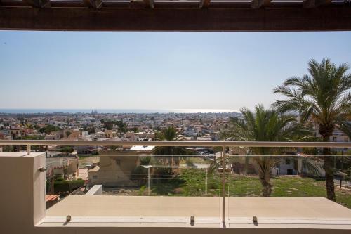 a view of a city from a window at Penthouse Duplex overlooking the Mediterranean in Larnaka
