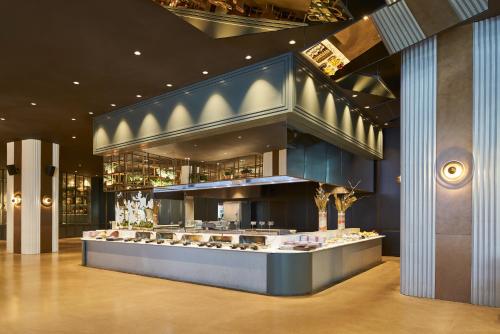 a store with a counter with a lot of desserts at Maxx Royal Belek Golf Resort in Belek