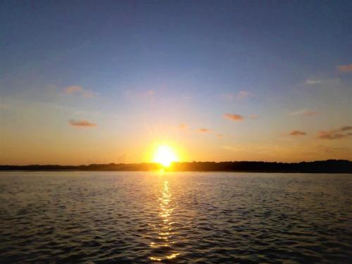 a sunset over a large body of water at Mida Creek Nature Camp in Watamu