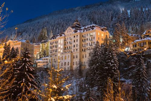 a hotel in the mountains with snow covered trees at De l'Europe Gastein in Bad Gastein