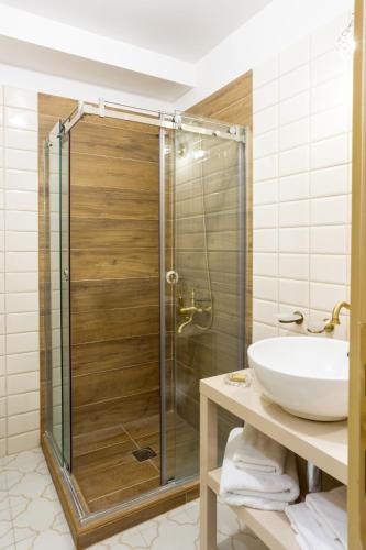 a bathroom with a shower and a sink at Mythic Valley in Litochoro