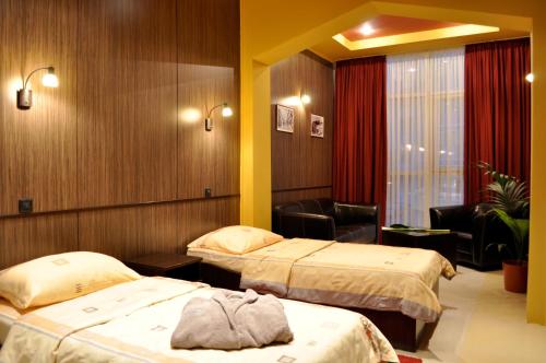 Cama o camas de una habitación en Hotel Fortuna