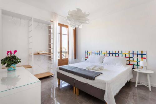 En eller flere senge i et værelse på La casa di Nonna Maria