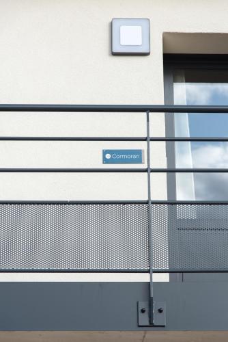 a sign on the side of a building at Résidence les Dombes in Rillieux