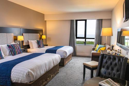 Postel nebo postele na pokoji v ubytování Ocean Sands Hotel