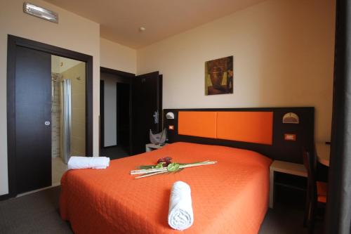Postel nebo postele na pokoji v ubytování Hotel Belvedere Spiaggia