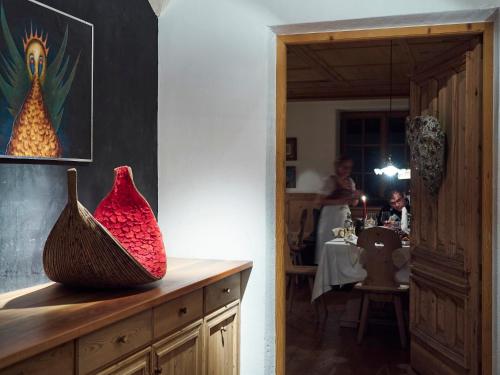 a room with two vases sitting on a counter at Romantik Hotel Turm in Völs am Schlern