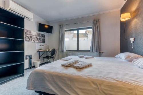 Postel nebo postele na pokoji v ubytování Hôtel de la Gare