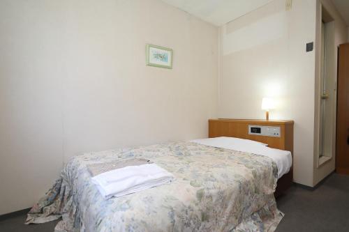 Postel nebo postele na pokoji v ubytování Hotel Tensui