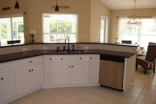 a kitchen with a sink and a counter top at VILLA PALM ISLAND in Cape Coral