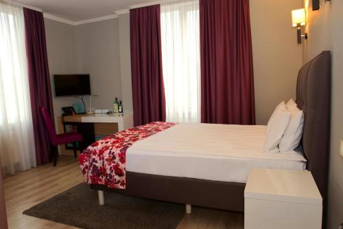 Voodi või voodid majutusasutuse City Park Hotel toas
