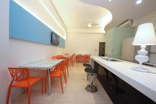 a dining room with a table and chairs at Chi Heng Homestay in Luodong