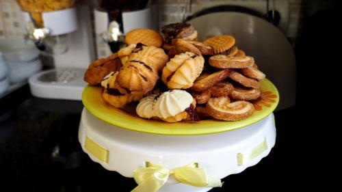 a plate of food on top of a table at Pensiunea Lucia in Sfântu-Gheorghe