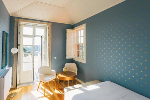 Letto o letti in una camera di Menina Colina Guesthouse