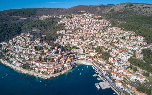 an aerial view of a town on the water at Beautiful villa Natura with pool in Labin in Labin