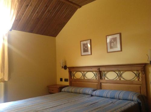 A bed or beds in a room at Casa Diego Apartamentos Turisticos