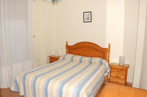 Postel nebo postele na pokoji v ubytování APCOSTAS - Atlanterra